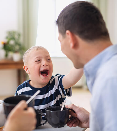 A delighted boy with a disability.